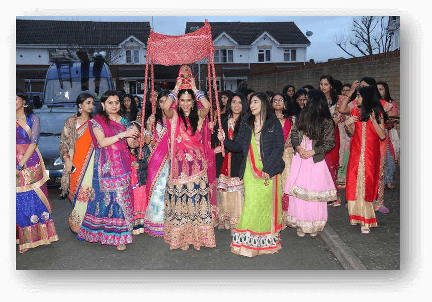 Girls and womenfolk returning with the earthen pot, dancing and singing songs of Gorbai